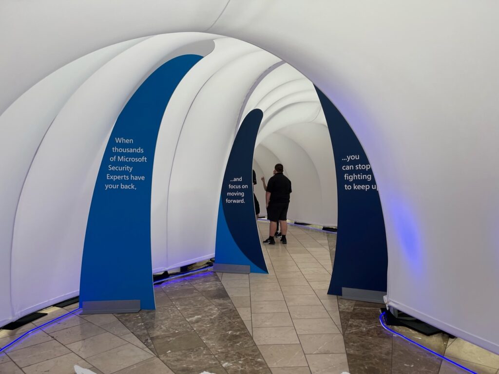 Wrap around tunnels envelope the audience for a Microsoft event