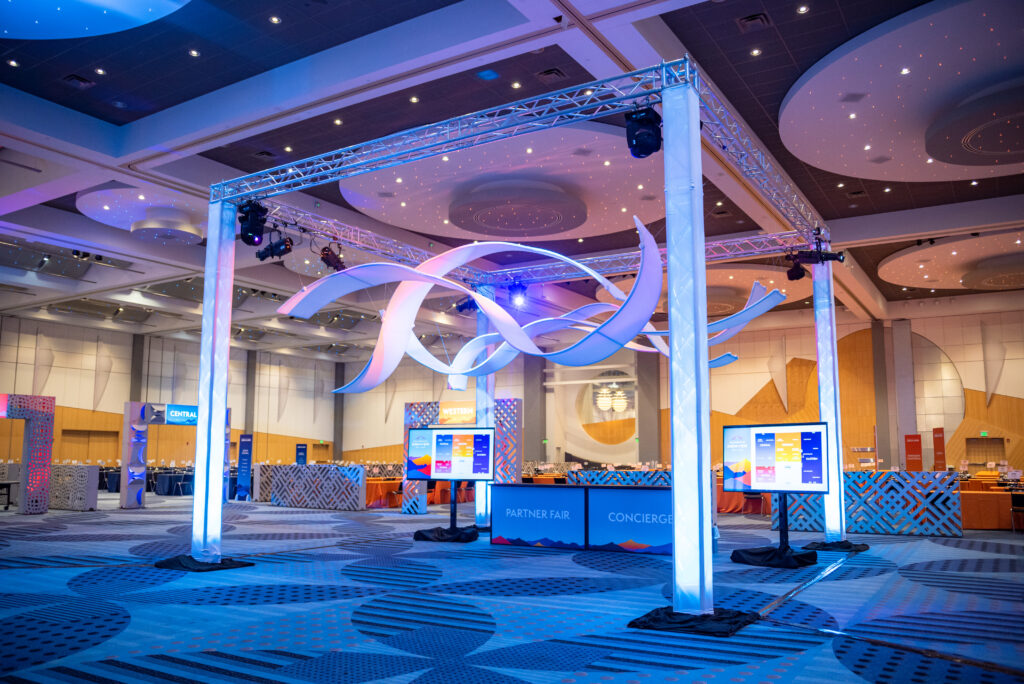 Use your height and create a ceiling treatment for your “otherwise uninvolved space.” This DIY installation feature The Originators designed Suspended AirWave ribbons with a rental price for your trade show or events, exhibitions or immersive environments. An Event Marketing trick in your back pocket. Don't forget to Look UP!