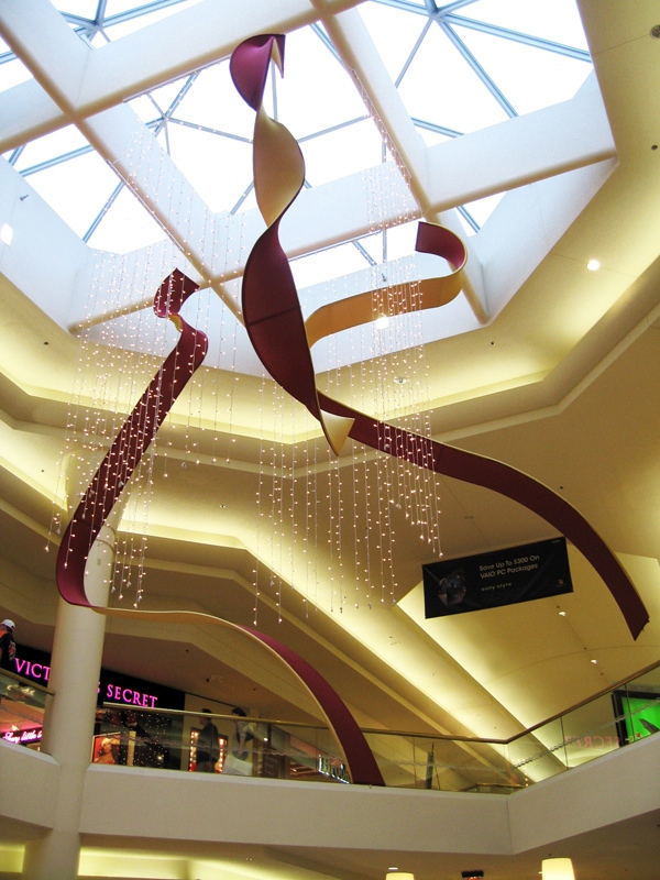 Giant Ribbons, by the Originators Design are our AirWaves suspended in a mall for the holidays, custom tension fabric ribbons for a visual merchandising company