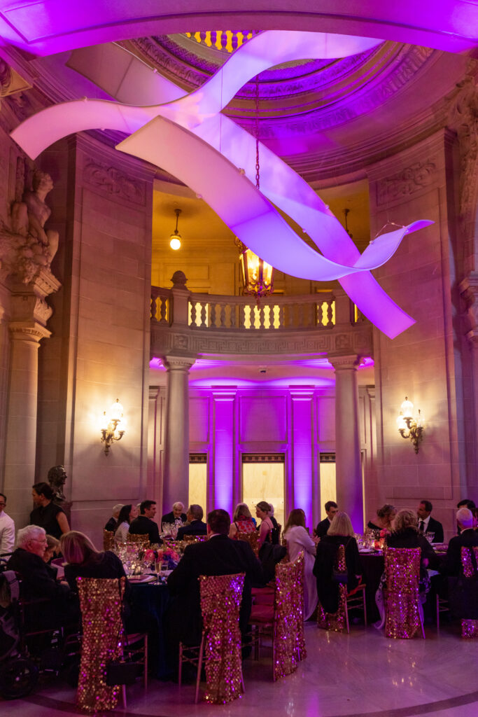 What elegance! This beautiful room, the San Francisco City Hall, is enhanced with The Originators tension fabric ribbons. The Opera Ball was a great success and the Originators Design rental AirWaves are seen suspended for great effect and entrance.